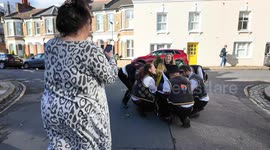 The Blackheath Morris Men perform the age-old ritual of chair lifting outside pubs in Greenwich long version