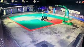 slippery basketball court leads to synchronized falls and laughter