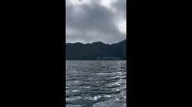 Near miss: phone photography at Lake Holon takes a dangerous turn