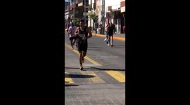 Runner Gets Superhero Escort to Finish Line