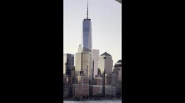 Crescent Moon Passing Behind One World Trade Center at Sunrise as seen from a Passing Cruise Ship