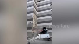 Taiwan earthquake rips tiles from building onto truck below