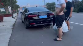 Chinese Man tricks wife into checking car, opens trunk to reveal surprise