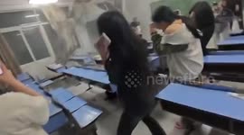 Terrified Chinese students flee as furious winds shatter windows in classroom