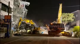 Taiwan authorities demolish damaged buildings following deadly earthquake