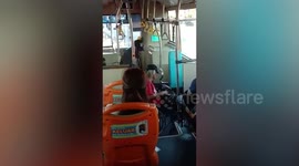 Bus driver helps disabled passenger cross the street