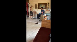 Child Uses Hoverboard to Clean Floor