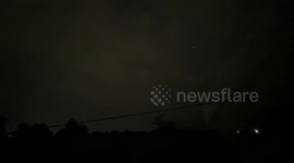 I pulled over on the side of the road to capture this brilliant lightning storm that came in out of nowhere and made no sound but lit up the night sky with rapid repeating lightning bolts crossing the clouds and striking down in the most violently beautif