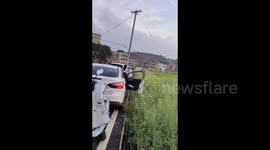 Woman Falls into Pit While Exiting Car in Quanzhou, China