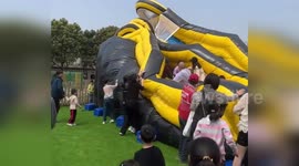 Children trapped under collapsed bouncy castle knocked over by sudden wind