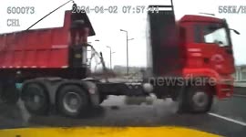 Dramatic dashcam footage shows near miss as truck plunges off bridge