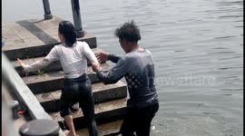 Heroic bystander rescues woman from river in dramatic 20-second effort