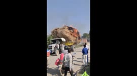 Grass truck inferno: electrical fire sparks emergency unloading in Sahson, India