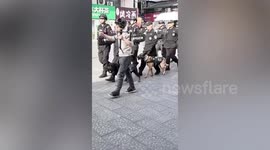 China’s only police Corgi dog spotted to be carried on policeman’s back during patrolling