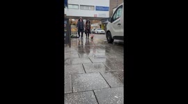 Dachshund Sports a Rain Coat