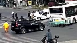 Chinese passersby team up to lift car up to rescue scooter rider trapped underneath