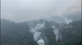 Air Force Helicopter Dispatches Water to Combat Forest Fire in Soloma, Guatemala