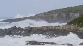 Kathleen Storm hits the West Country, Huge seas crash onto beaches, lifeguards and beach-goers watch. Fistral Bay, Cornwall