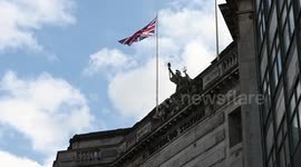 A very Large United Kingdom flag Flying Above Waterloo Station