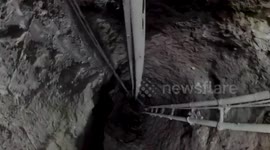 Rescuers search for two miners trapped in illegal tunnel in the Philippines