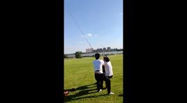 Strong wind proves too much for friends flying kite