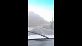 Caravan blown off bridge outside Huguenot Tunnel, outside Cape Town. Huge storm causing massive damage in Cape Town