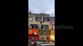Students desperately escape through windows from burning tutoring centre in China