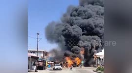 Shocking moment oil tanker turns turtle killing one and injuring eight after it catches fire