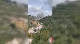 Israeli warplanes bomb a location in the village of Deir Qanoun, Lebanon