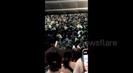 Quick-thinking Chinese passenger smashes glass door to avoid stampede in overcrowded railway station