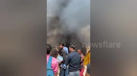The Officials douse massive fire that breaks out in shop near temple in Northern India