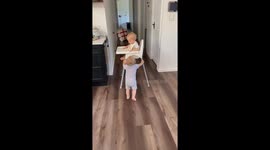 Twins Make A Break For It With High Chair