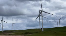 Captivating Timelapse of rotating wind turbines in unique rotations.