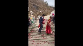 Newlyweds embrace traditional bamboo dance, celebrating love and growth at wedding
