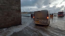 Waves whipped up by storm crash onto St Ives promenade as weather warning issued for Cornwall