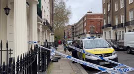 Police cordon outside London home where woman was stabbed to death