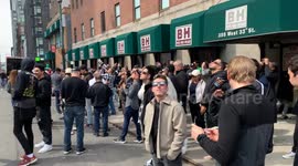 New Yorkers and Tourists are seen watching the solar eclipse in Manhattan.
