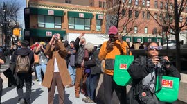 New Yorkers and Tourists are seen watching the solar eclipse in Manhattan.