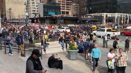 New Yorkers and Tourists are seen watching the solar eclipse in Manhattan.