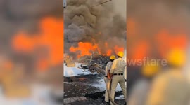 Officials extinguish flames after fire erupts at chemical factory in north India