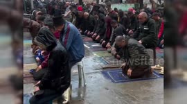 Residents of North Gaza Pray in the Rain for Eid
