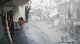 Avalanche of snow cascading off house roof narrowly misses homeowner