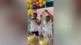 Couple pulls out surprise money gift from cake for wedding anniversary