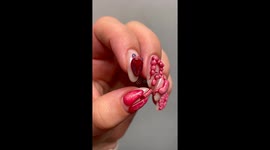 A close up video of my nails wearing tiny 3D charms that look like human organs. They are a stomach, some brains, a colon, lungs, and a heart. They are hand sculpted and painted by me.