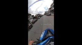 Delivery rider falls after collision with rolling basketball