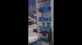 Terrifying scene unfolds as child dangles from fourth-floor balcony in Primorye, Russia