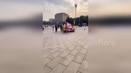 Turf war between balloon sellers results in explosion as people try to separate them