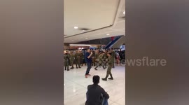 Ukrainian sings in karaoke with Filipino soldier as backup dancer