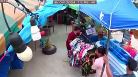 Storm blows over tents as it batter roadside shops in Thailand