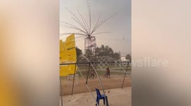 Storm gales blow through temple fairground in Thailand